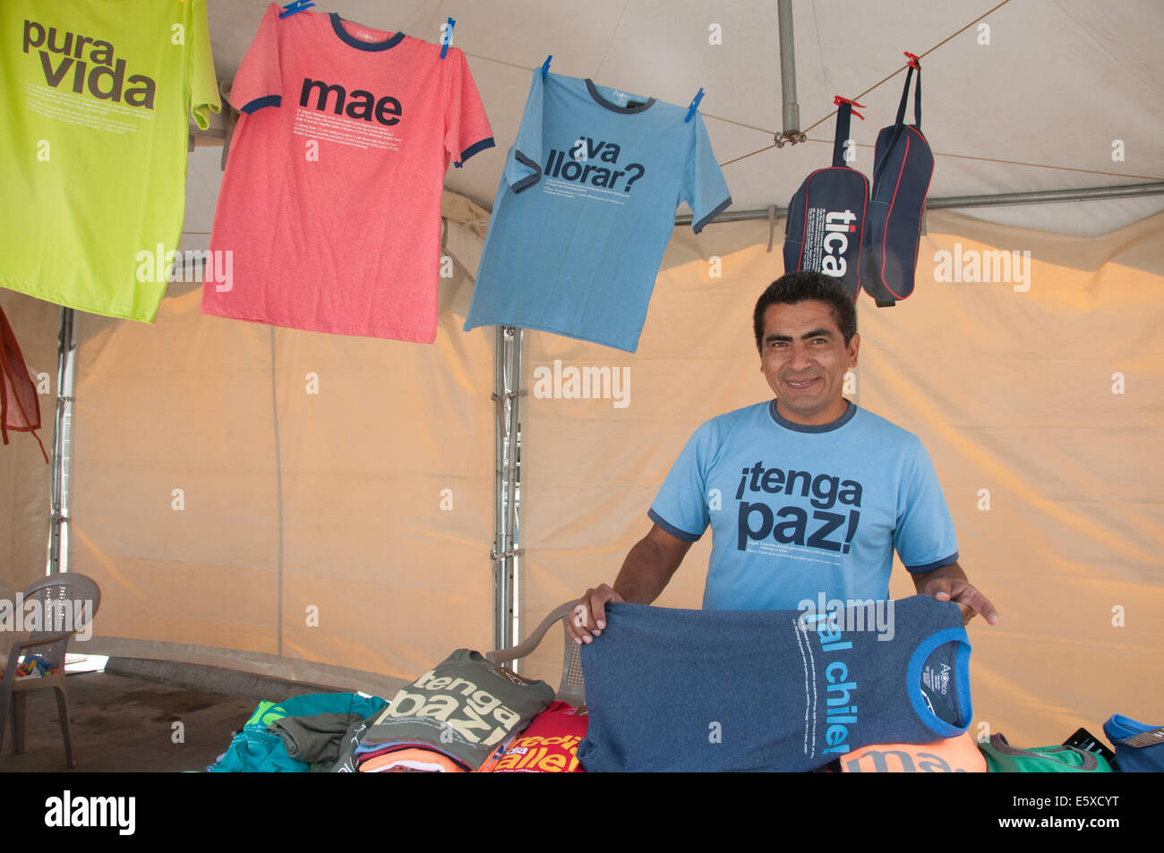 Artisan selling locally made t-shirts in Escazu , suburb of San José Costa Rica Stock Photo