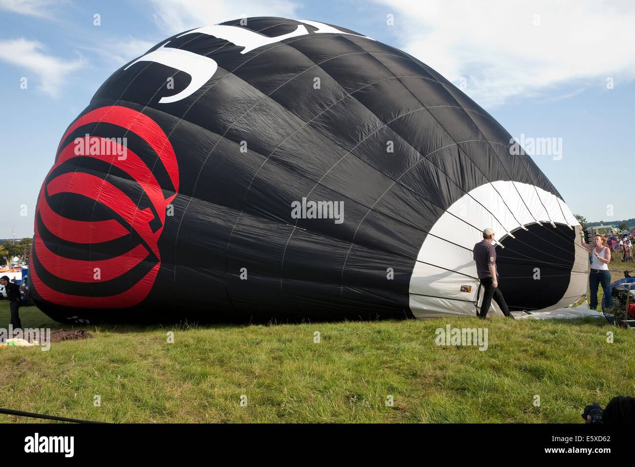 Bristol, UK. 7th August, 2014. The JLL balloon starts to inflate at the Bristol International Balloon Fiesta Credit: Keith Larby/Alamy Live News Stock Photo