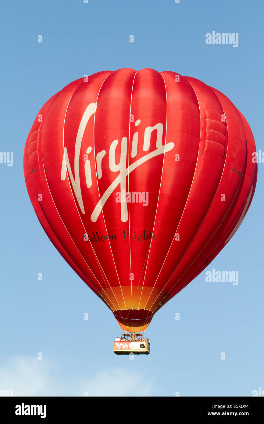 Bristol, UK. 7th August, 2014. Virgin balloon flies high during the evening launch at the Bristol International Balloon Fiesta Credit: Keith Larby/Alamy Live News Stock Photo
