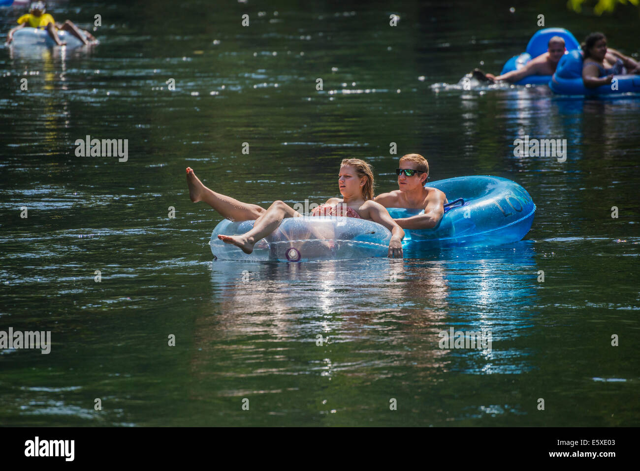 Tubing down the Ichetucknee River in North Florida is a great way to spend the 4th of July holiday. Stock Photo