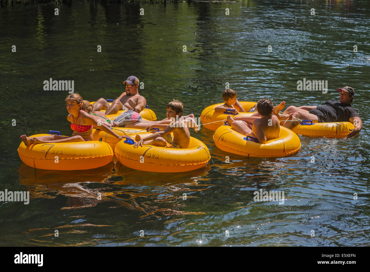 Tubing down the Ichetucknee River in North Florida is a great way to spend the 4th of July holiday. Stock Photo