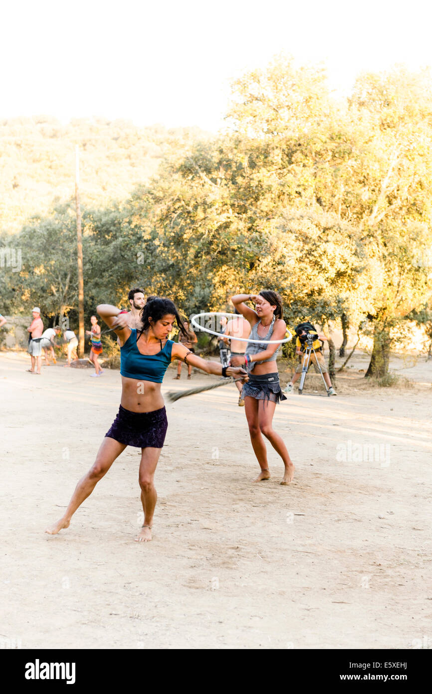 Idanha-a-Velha, Portugal. 6th August, 2014. Spectators of a concert by Mahadev Cometo doing Poi and Hulahoop at BOOM Festival, an eco-friendly music festival in Portugal. 6th of August 2014. Credit:  Tom Arne Hanslien/Alamy Live News Stock Photo