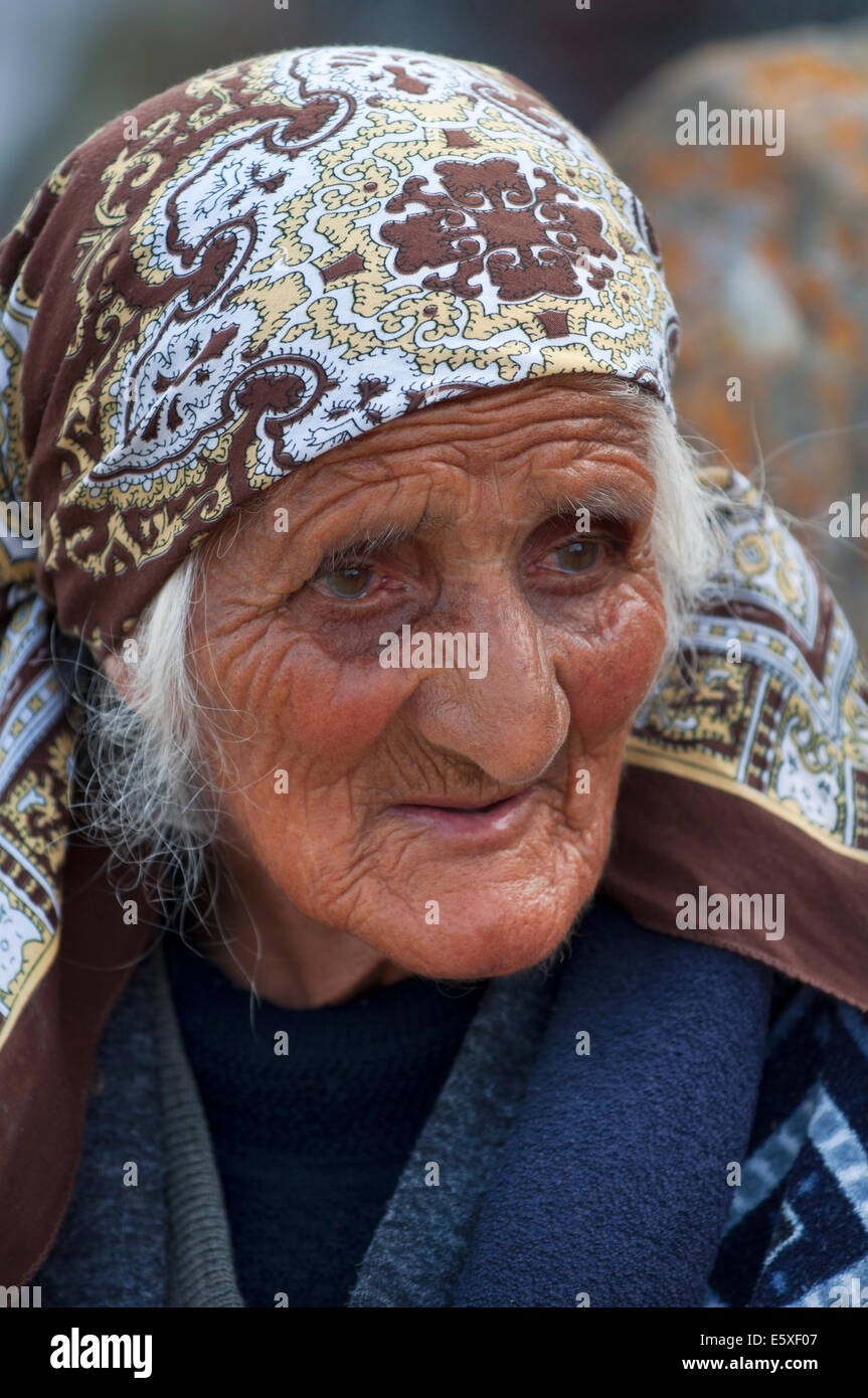 Old woman with a sad expression, Noratus cemetery, Armenia Stock Photo