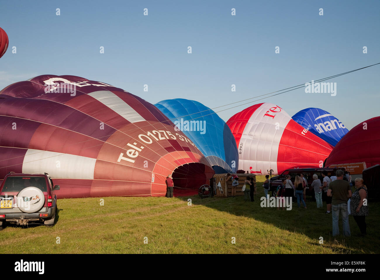 Bristol, UK. 7th August, 2014. Balloon inflation at the evening launch during the Bristol International Balloon Fiesta Credit: Keith Larby/Alamy Live News Stock Photo