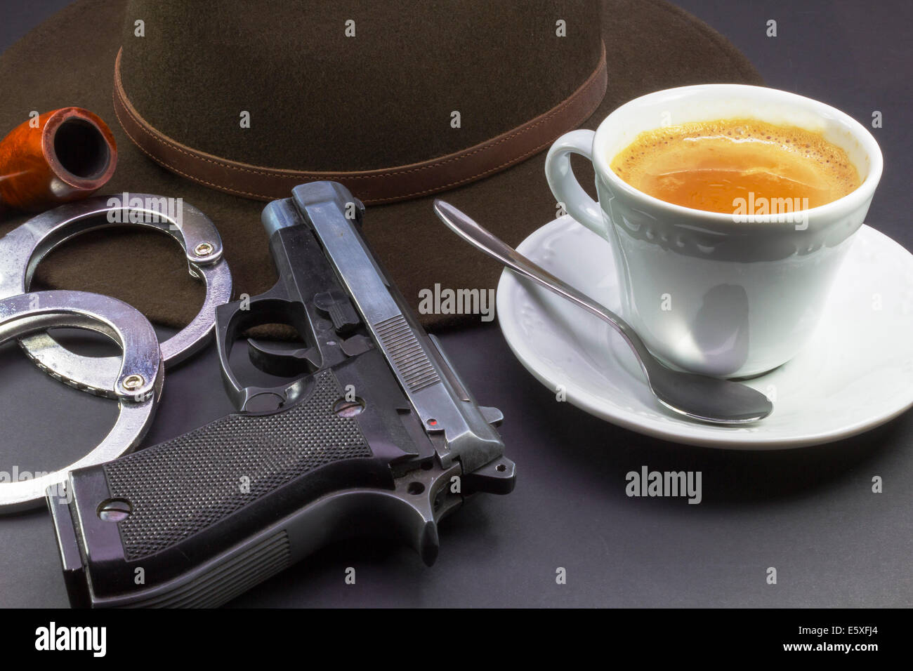 coffee detective, hat pipe gun and handcuffs Stock Photo