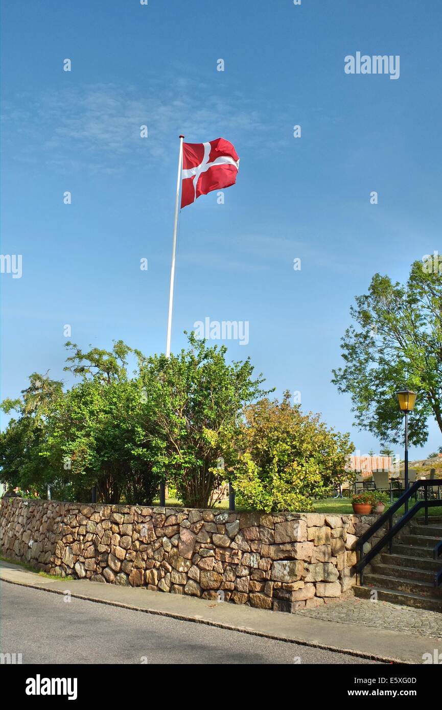 Denmark, Bornholm Island Pictures taken between 1st and 5th August 2014.  Pictured: Street in the Allinge city with Danish flag on the wind Stock Photo
