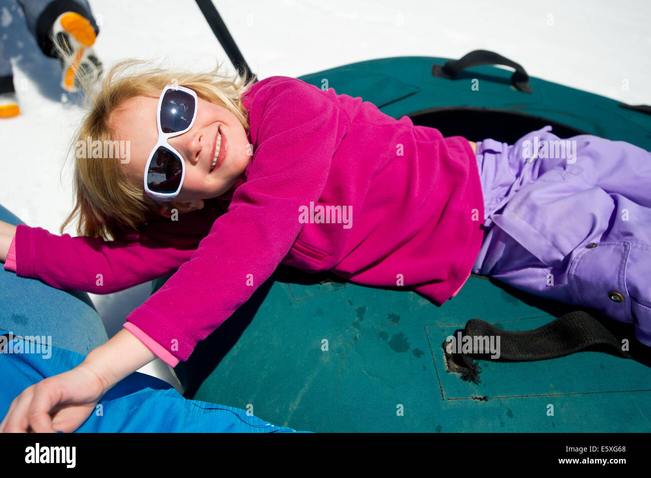 Lucy Weiss enjoys tubing at Snowbird Resort in Utah. Stock Photo