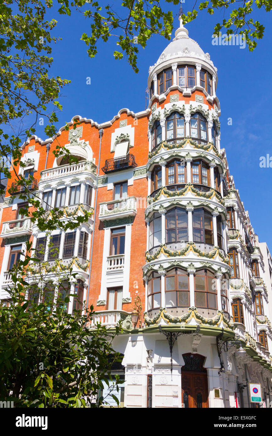 nice old building with highly decorated facade and large windows in Valladolid, Spain Stock Photo