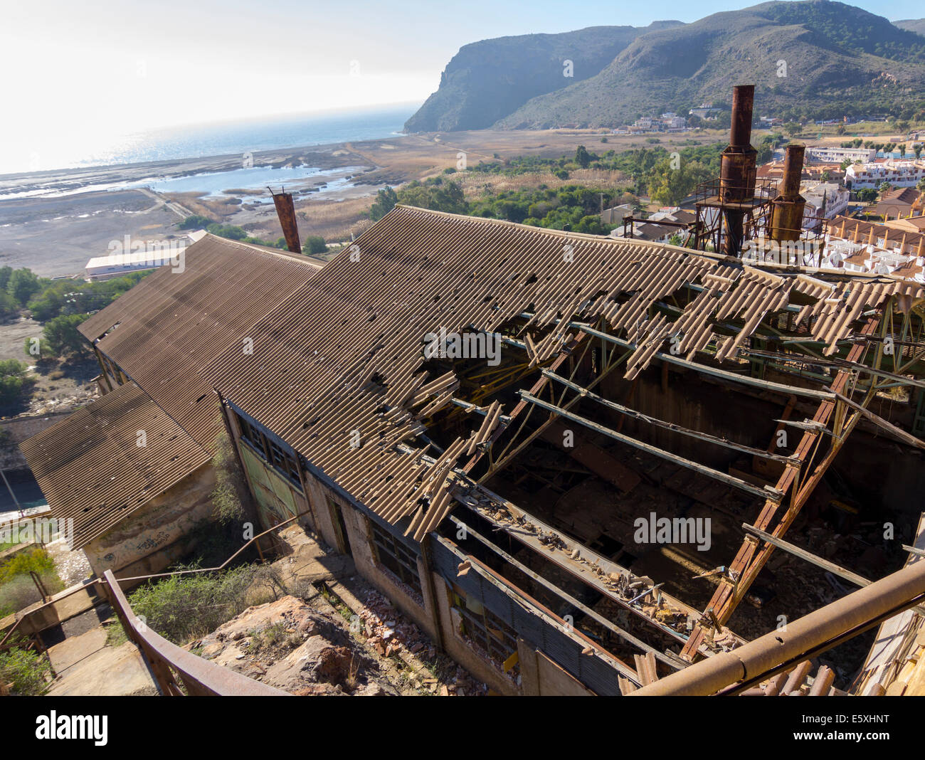 broken and destroyed roof of an old abandoned industry Stock Photo