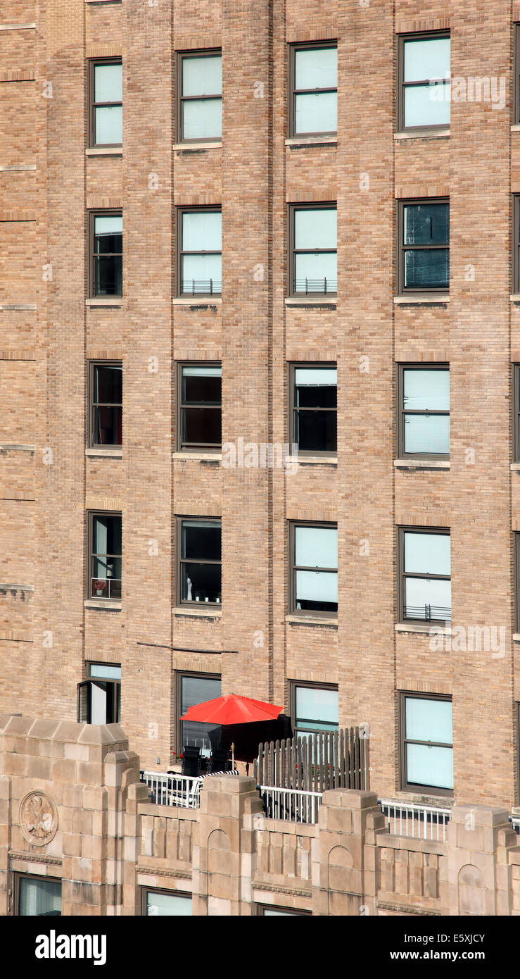 NYC Downtown apartment with red sunshade. Stock Photo