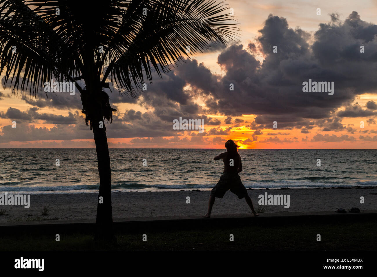 Silhouette of guy on beach Stock Photo