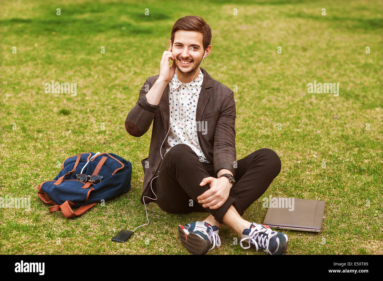fashion young guys consider shopping with shopping bags in their hands