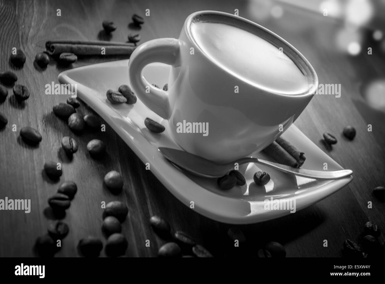 hot cup of coffee and cinnamon on wood table Stock Photo Alamy