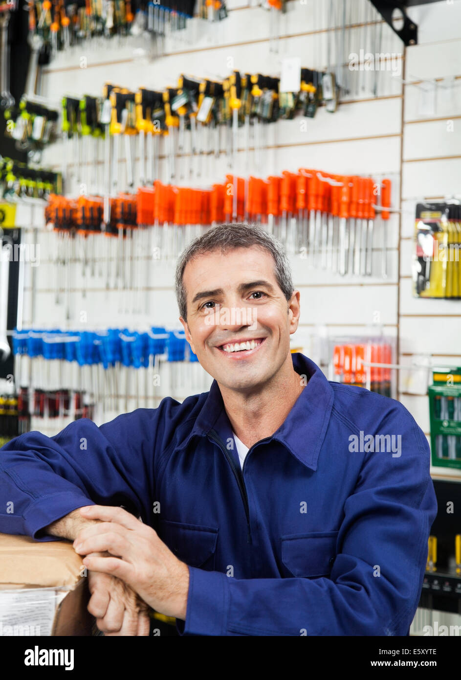 Salesperson working in hardware store hires stock photography and