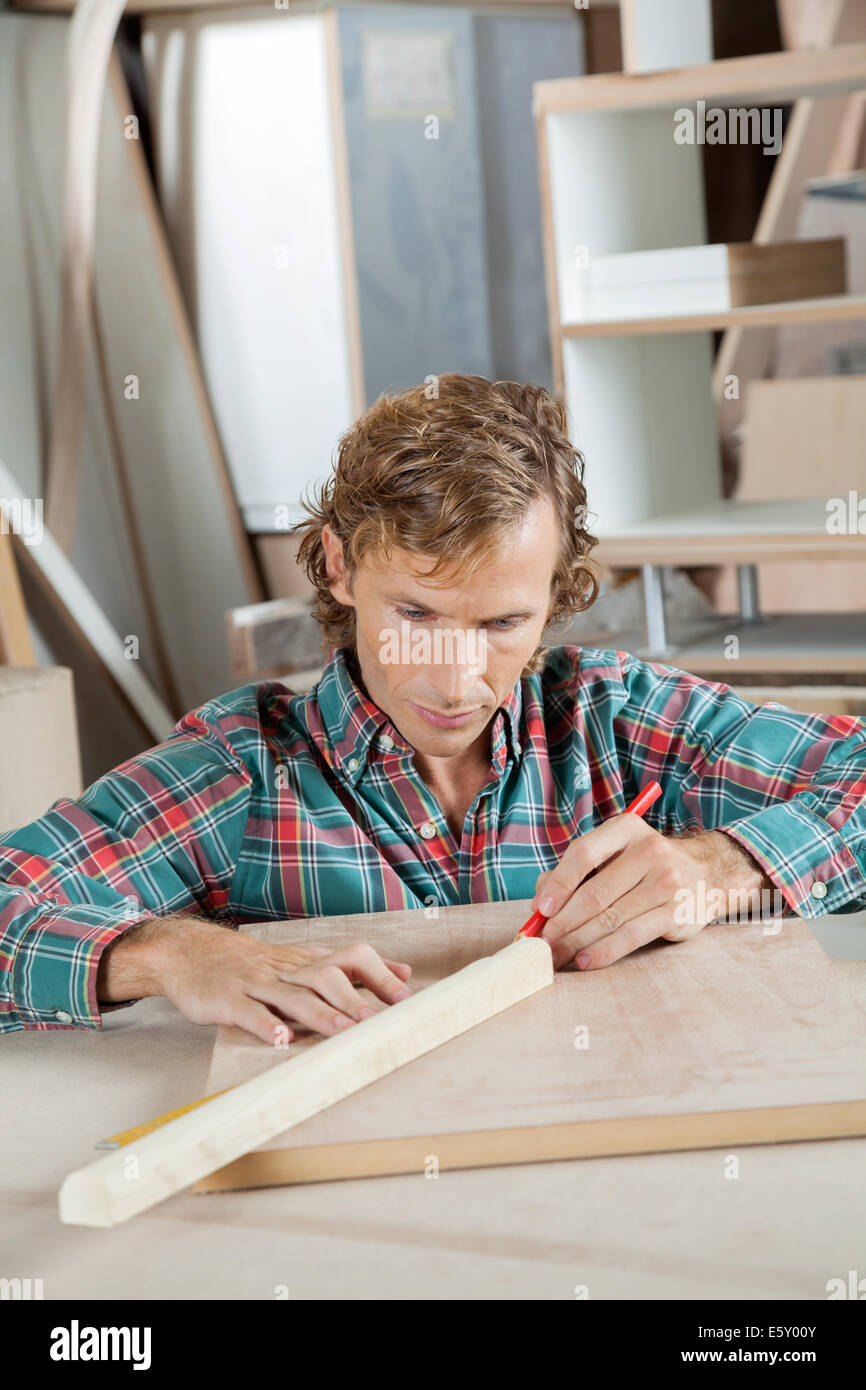 Carpenter Marking On Wood With Pencil Stock Photo Alamy