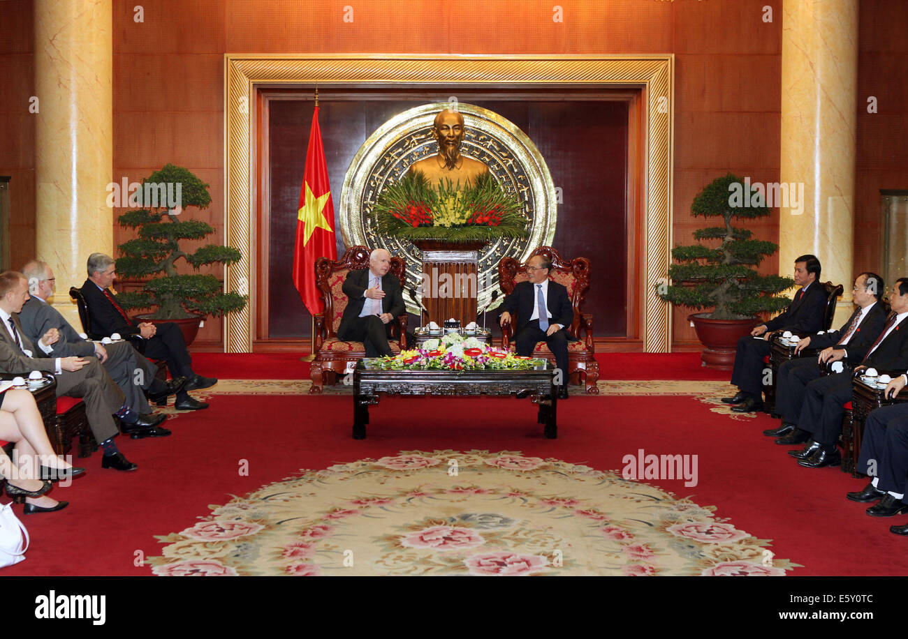 Hanoi. 8th Aug, 2014. Vietnam's National Assembly Chairman Nguyen Sinh Hung (R Center) meets with the visiting U.S. Senator John McCain (L Center) in Vietnam's capital Hanoi on Aug. 8, 2014. U.S. Senators John McCain and Sheldon Whitehouse said that they will urge the U.S. Congress to soon lift the ban on lethal weapon sale to Vietnam. Credit:  VNA/Xinhua/Alamy Live News Stock Photo