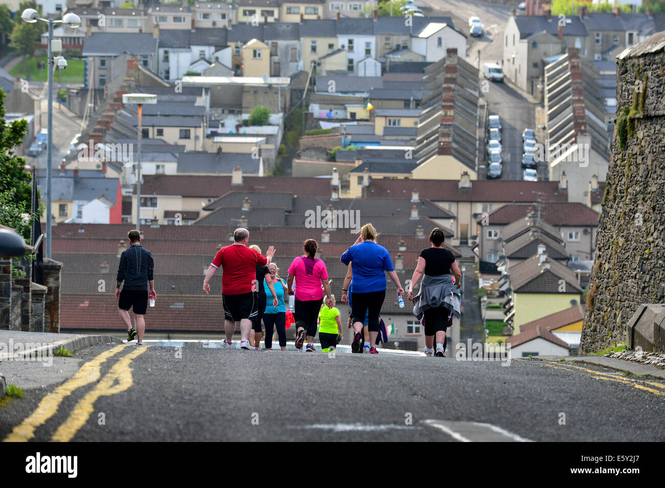Adults participating in boot camp run, Derry, Londonderry, Northern Ireland. Stock Photo