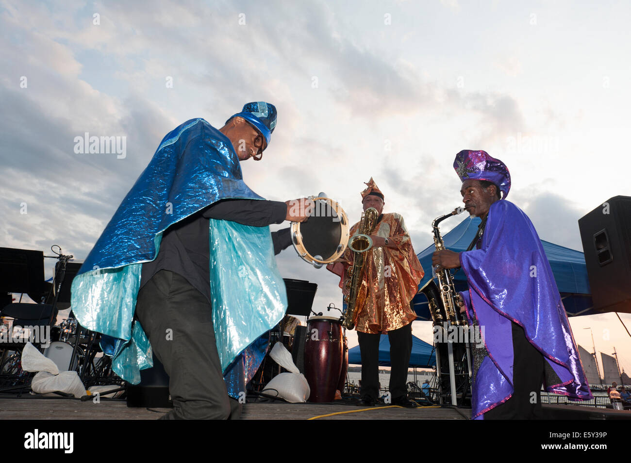 New York, USA. 7th August, 2014.  In a park next to the Hudson River, the Sun Ra Arkestra played a jazz concert in Battery Park City on Aug. 7, 2014. This would have been the 100th birthday of Sun Ra, the Arketra's founder. Credit:  Terese Loeb Kreuzer/Alamy Live News Stock Photo