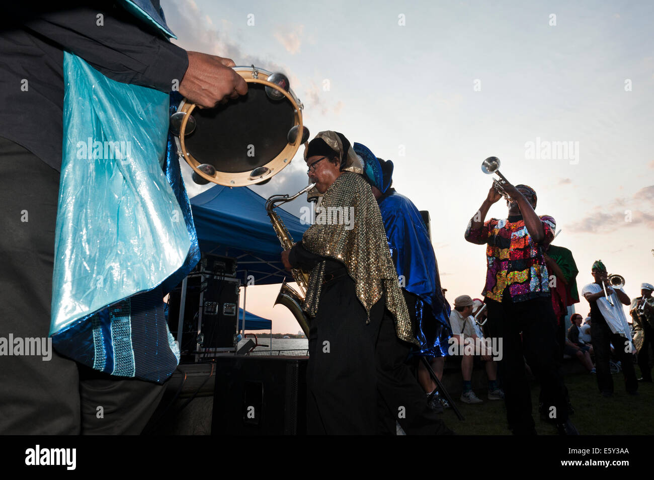 New York, USA. 7th August, 2014.  In a park next to the Hudson River, the Sun Ra Arkestra played a jazz concert in Battery Park City on Aug. 7, 2014. This year marks the 100th birthday of Sun Ra, the Arketra's founder. Credit:  Terese Loeb Kreuzer/Alamy Live News Stock Photo