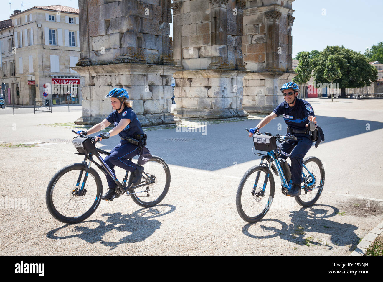 Two French Police Municipale on patrolling on bicycles. Stock Photo