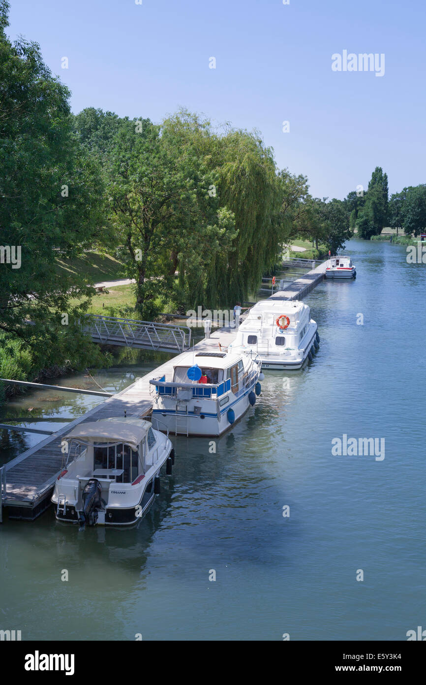 Motor boats moored on the River Charente at Saintes. Stock Photo