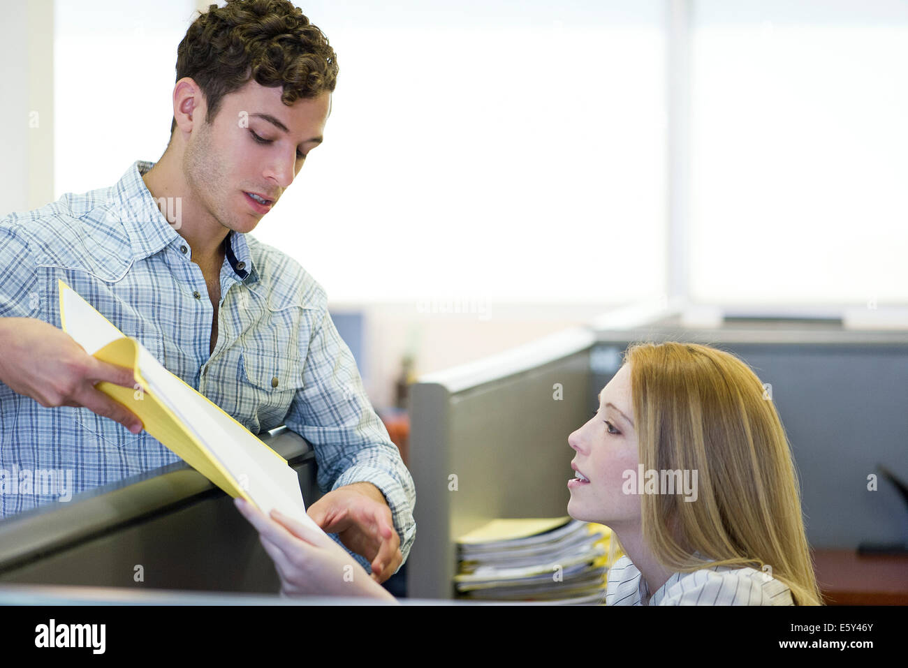 Manager explaining assignment to office worker Stock Photo