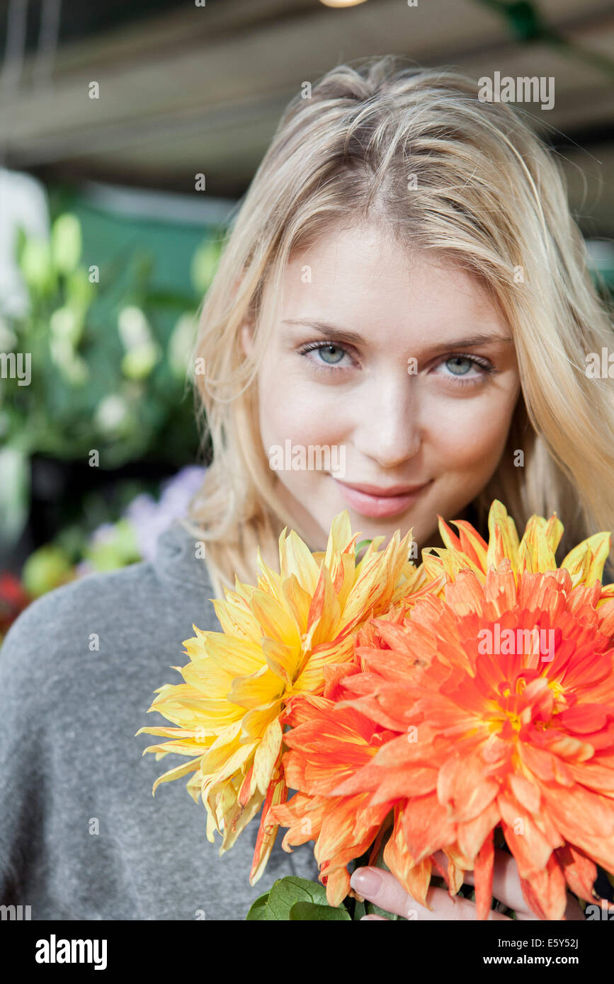 Young woman with flower bouquet, portrait Stock Photo - Alamy