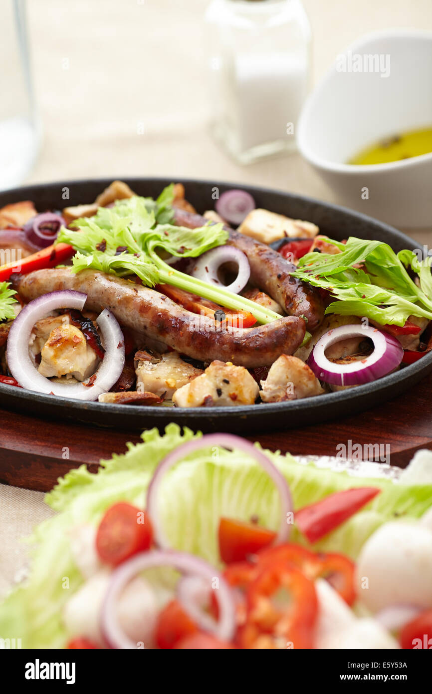 baked diced chicken and sausage with onions, peppers, mushrrooms and a