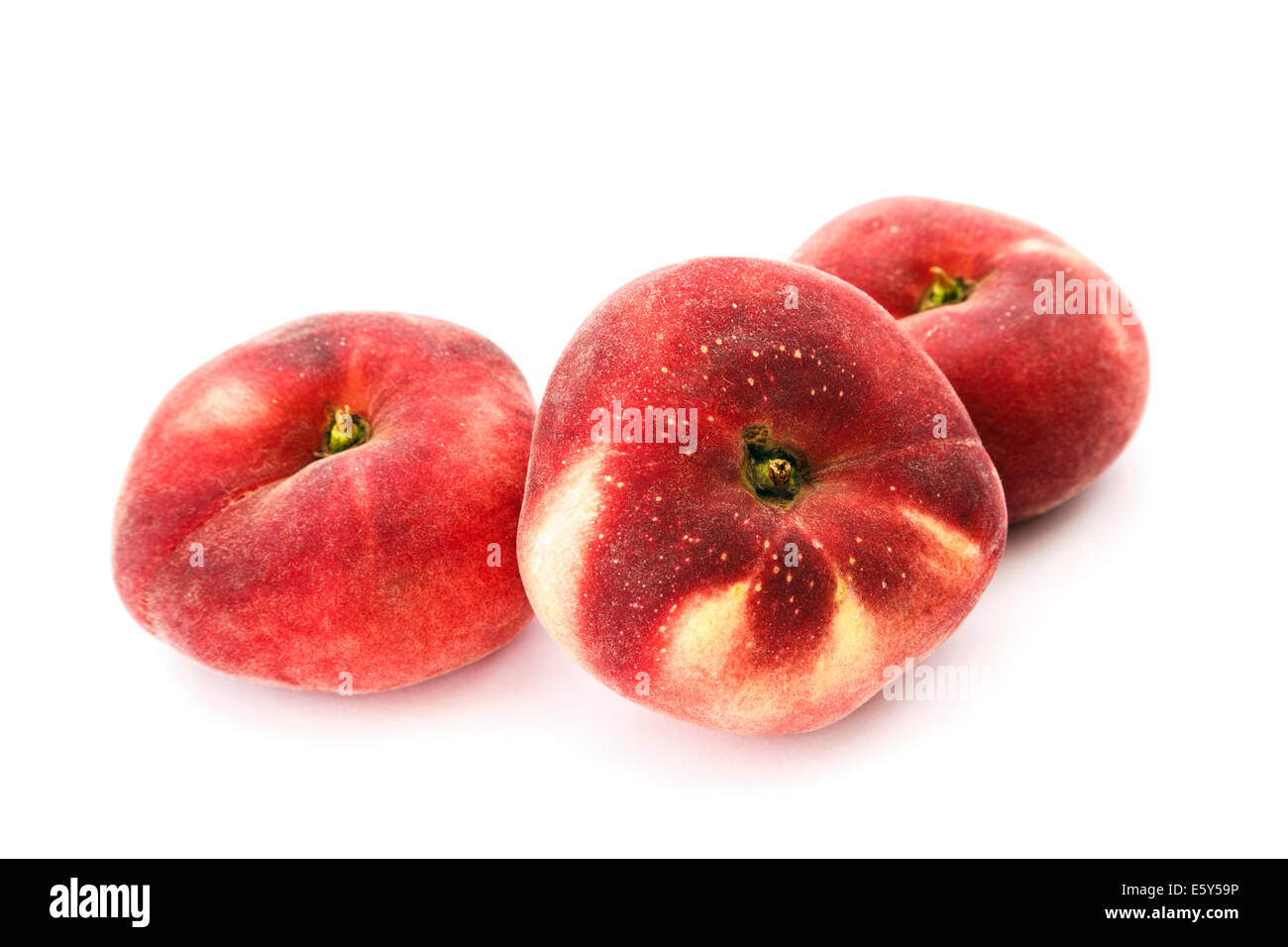 Three Donut (Doughnut), Paraguayo, Saturn or Flat peaches isolated on a