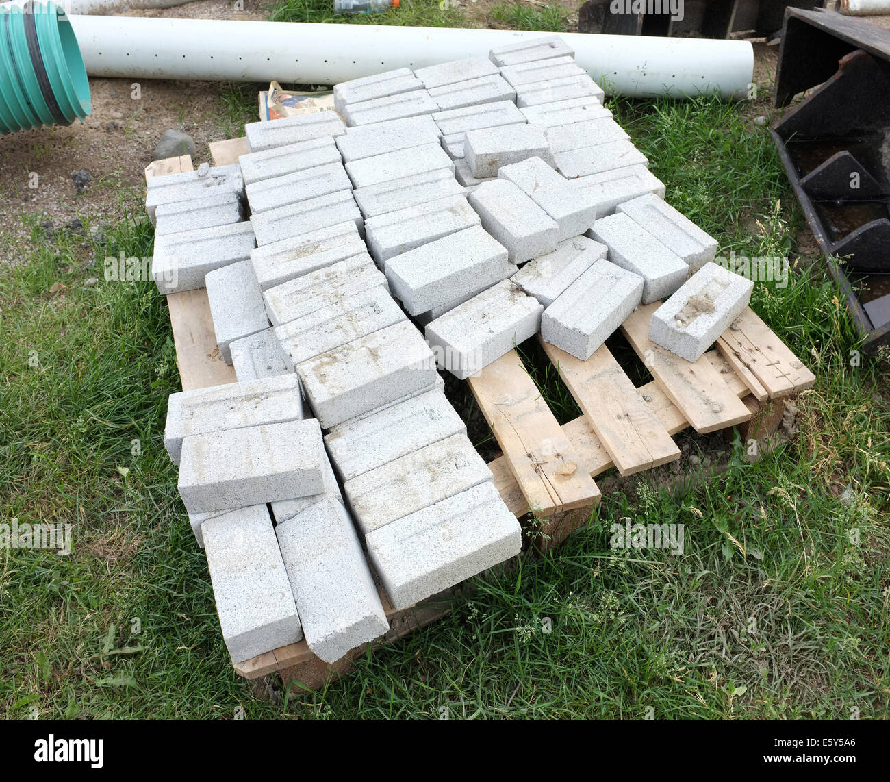 A pile of bricks at the side of a building site in Canada Stock Photo ...