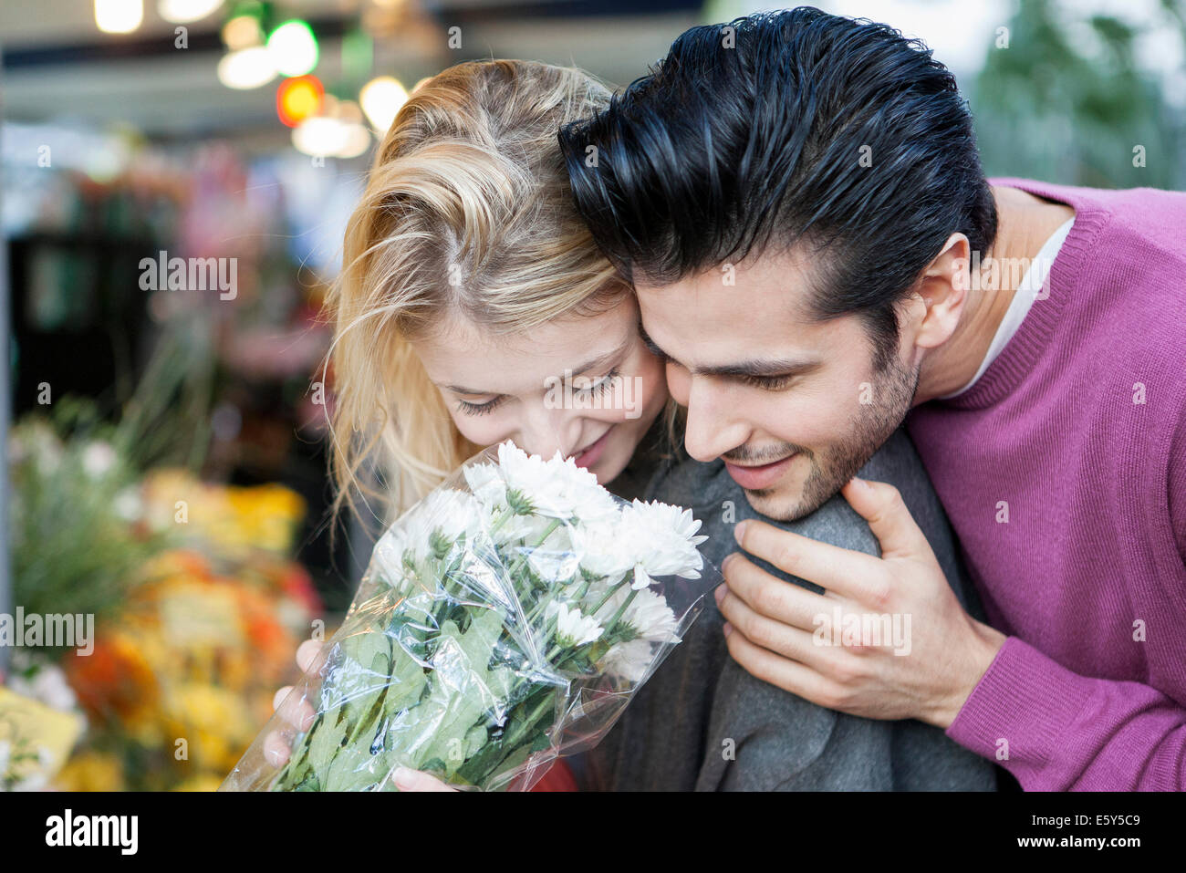 Young couple with flower bouquet Stock Photo