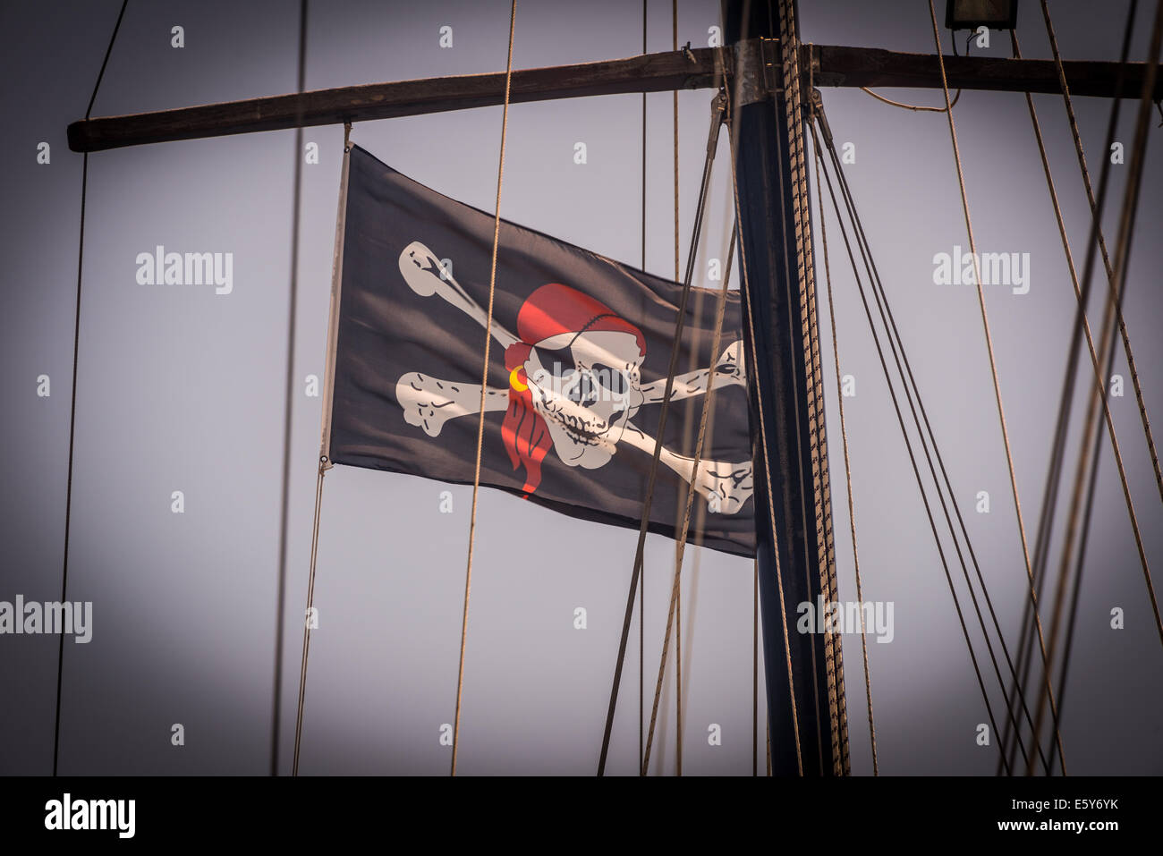 Pirate flag in the rigging of boat in Poros, Kefalonia, Greece Stock Photo