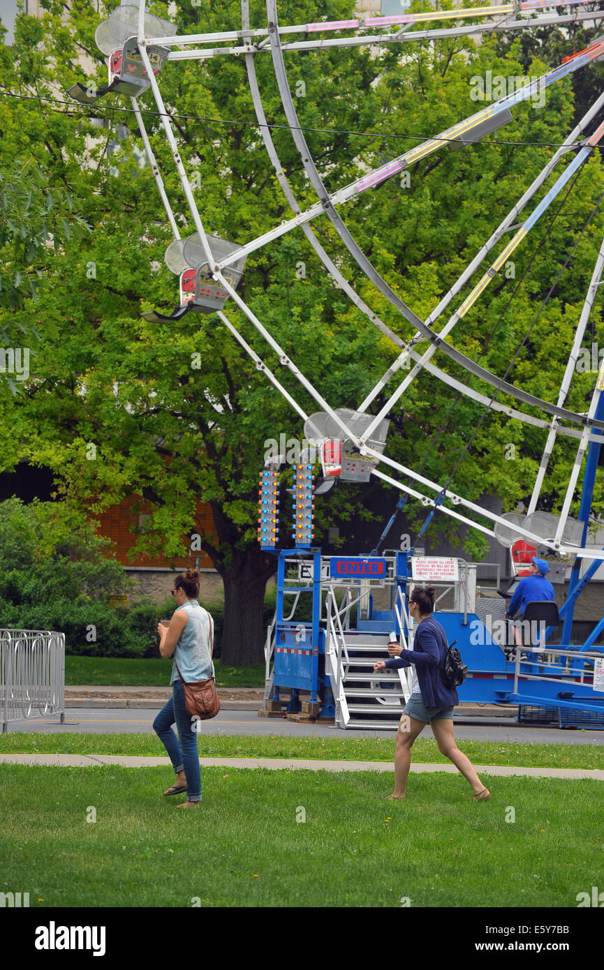 People attending a funfair in London, Ontario. Stock Photo