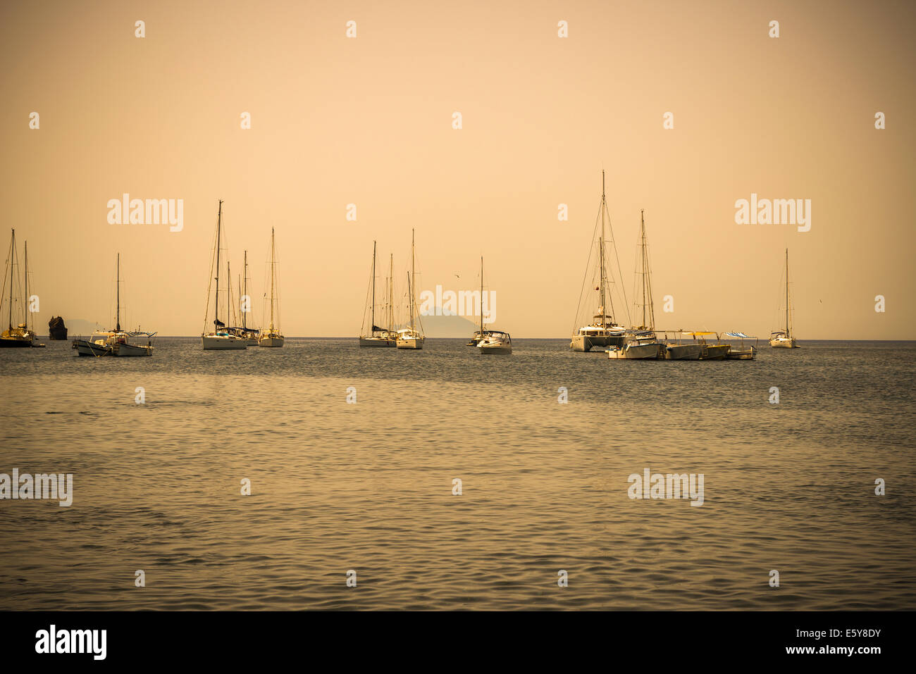 Aeolian sea landscape with yachts in sepia colors Stock Photo