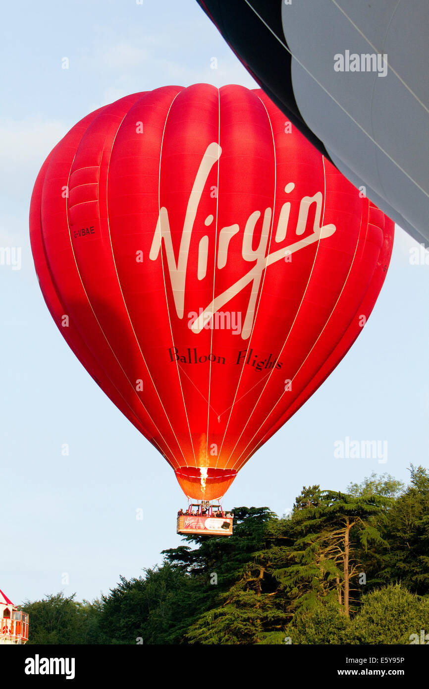 Bristol, UK. 8th August, 2014. Virgin Balloon lifts off during the Bristol International Balloon Fiesta Credit: Keith Larby/Alamy Live News Stock Photo