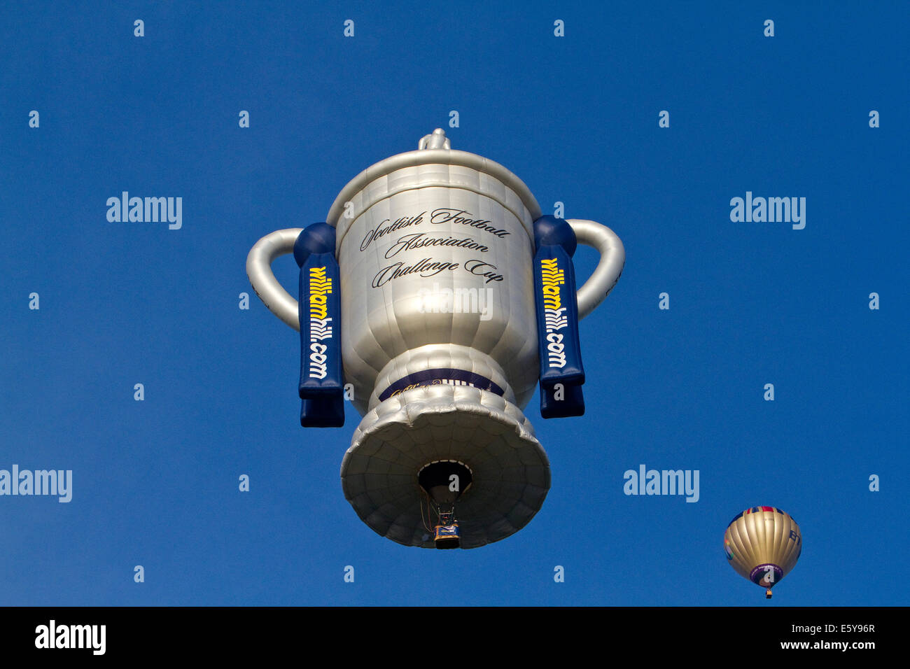 Bristol, UK. 8th August, 2014. Football cup Balloon lifts off during the Bristol International Balloon Fiesta Credit: Keith Larby/Alamy Live News Stock Photo