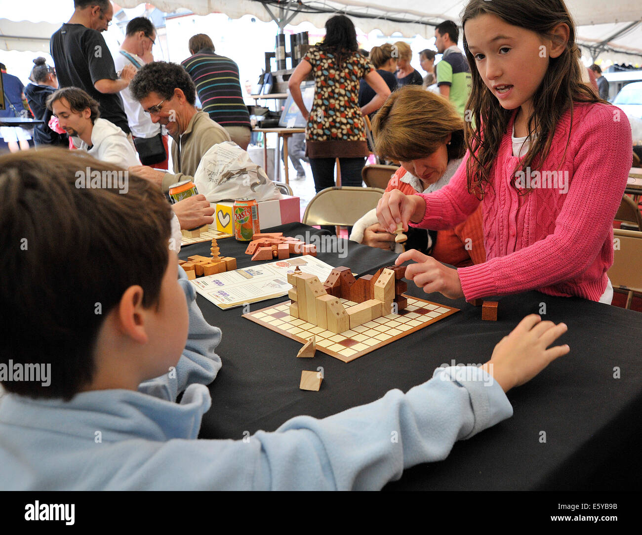 Youngsters playing board game at the Flip games festival in Parthenay Deux-Sevres France Stock Photo