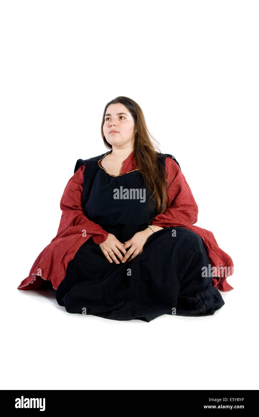 An isolated photo of a woman in a fancy medieval dress Stock Photo