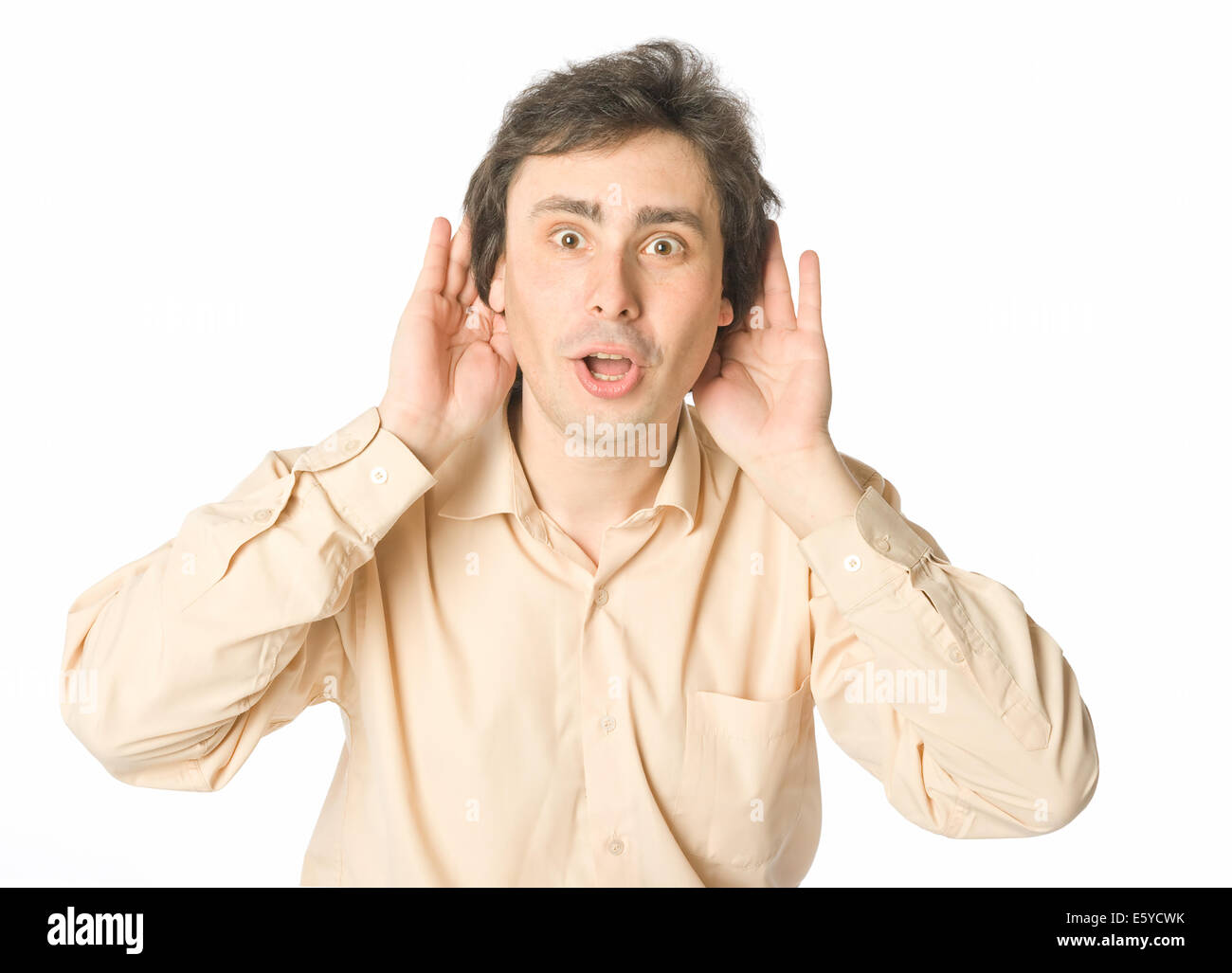A man listening to something with a surprise Stock Photo