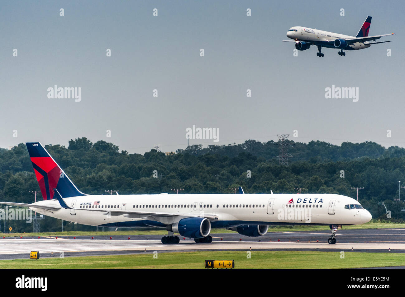 Delta Airlines jets arriving and departing at Hartsfield-Jackson Atlanta International Airport, the world's busiest airport. USA Stock Photo