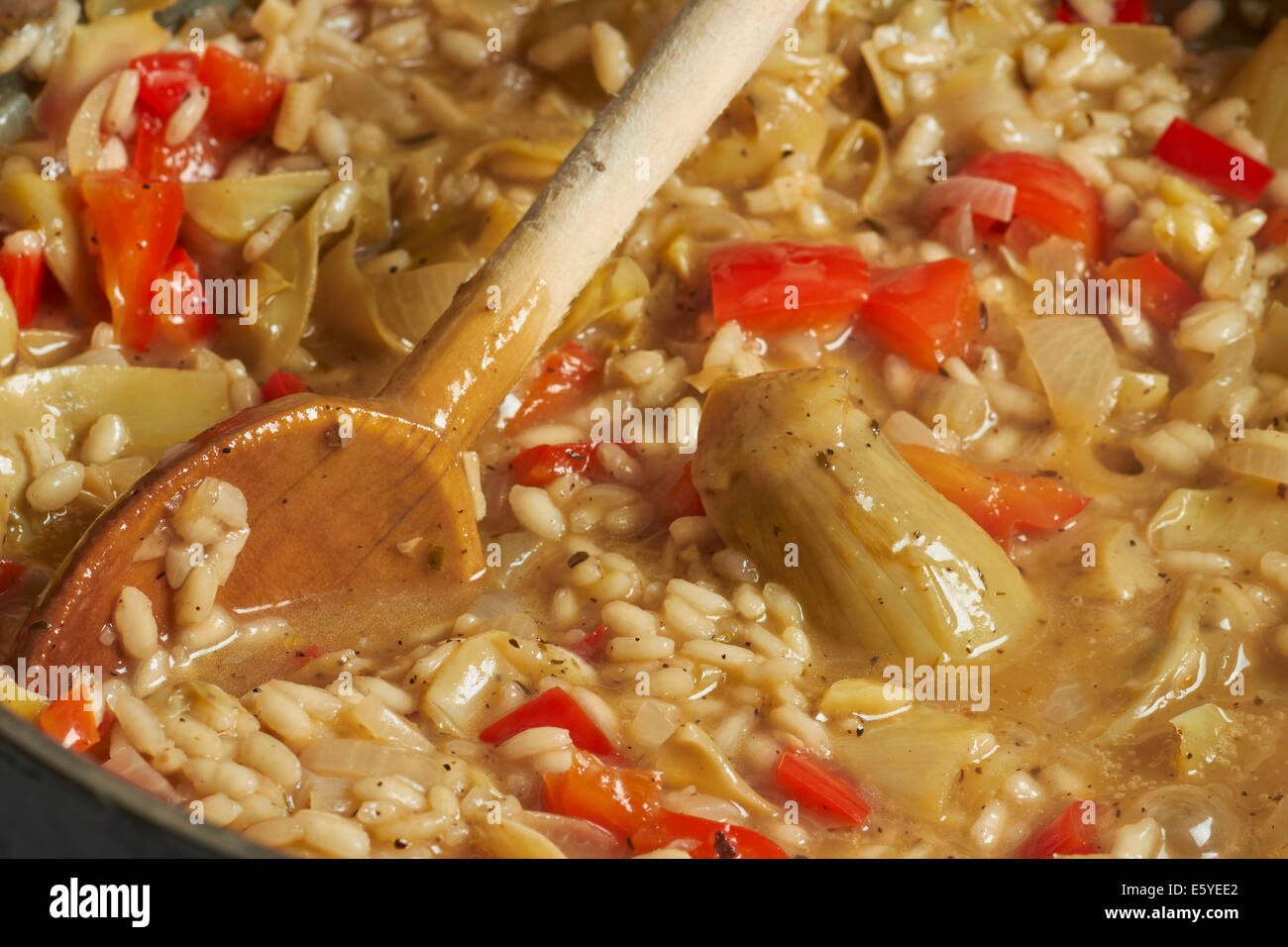 Risotto with artichokes and red peppers Stock Photo