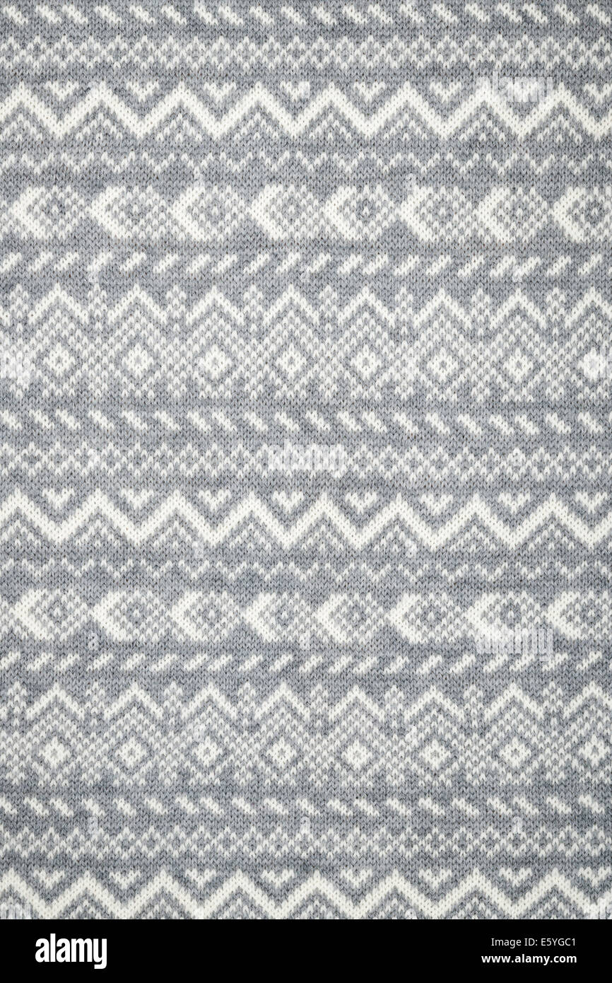 Knit fabric background with knitted grey and white geometric pattern ...