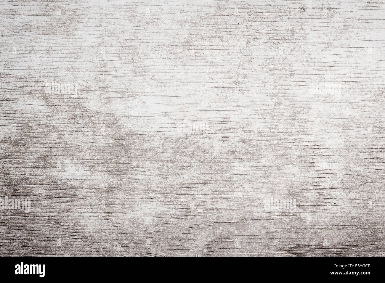 Gray wooden background of weathered distressed rustic wood with faded white paint showing woodgrain texture Stock Photo
