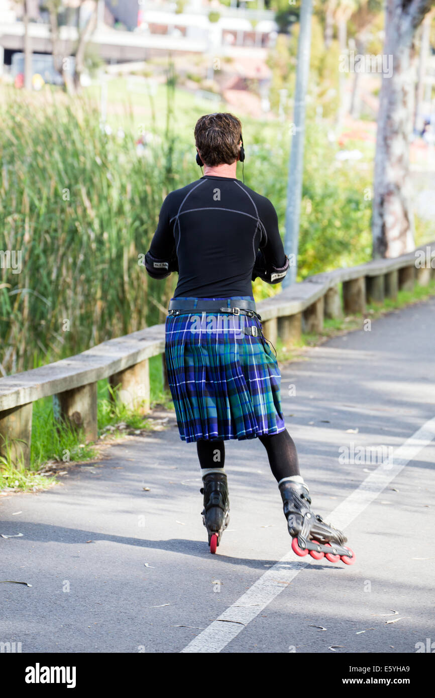 Man in kilt rollerblading in Adelaide Australia Stock Photo