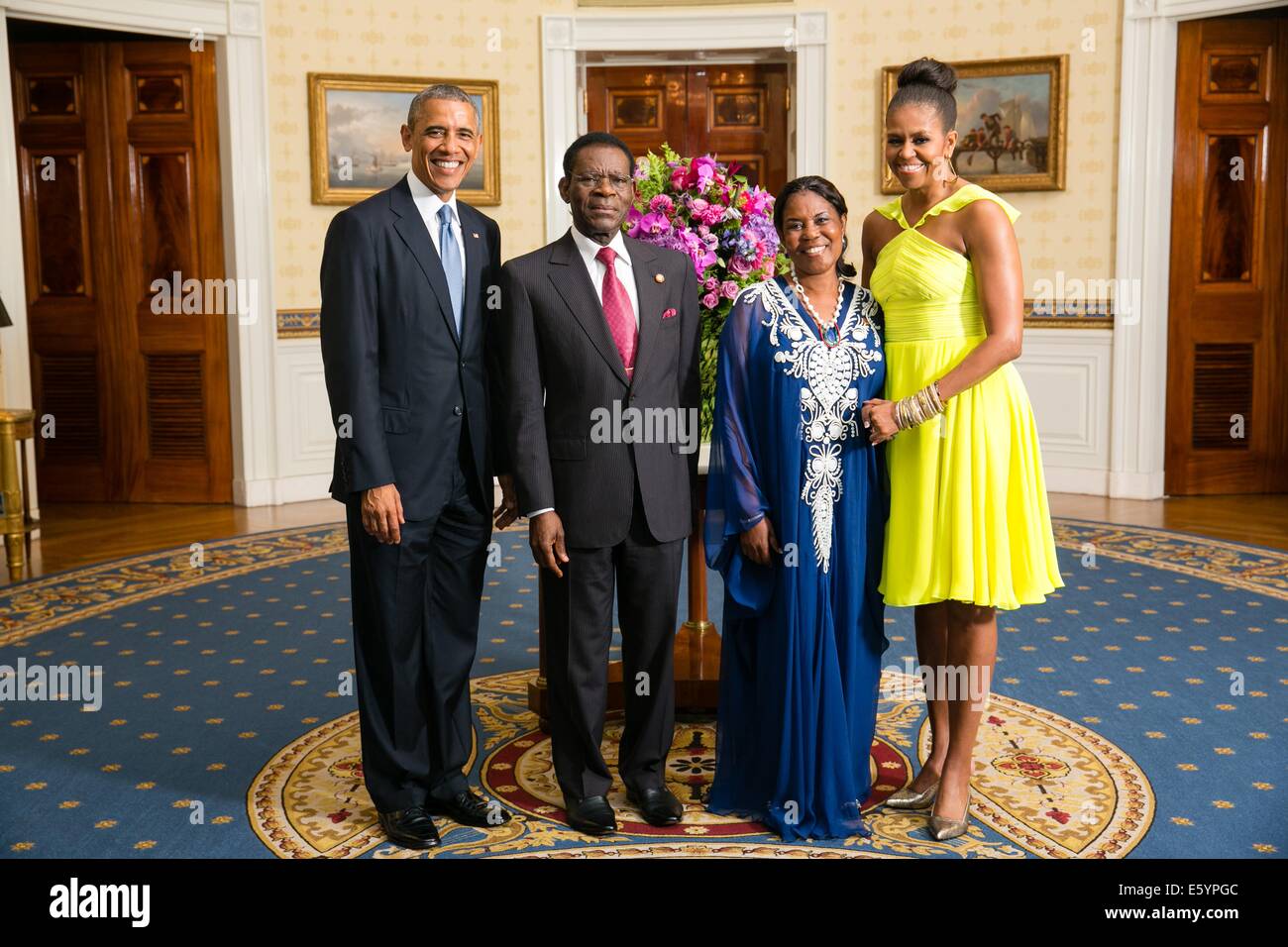 US President Barack Obama and First Lady Michelle Obama pose with Teodoro Obiang Nguema Mbasogo, President of the Republic of Equatorial Guinea, and his wife Constancia Mangue de Obiang, in the Blue Room of the White House before the U.S.-Africa Leaders Summit dinner August 5, 2014 in Washington, DC. Stock Photo