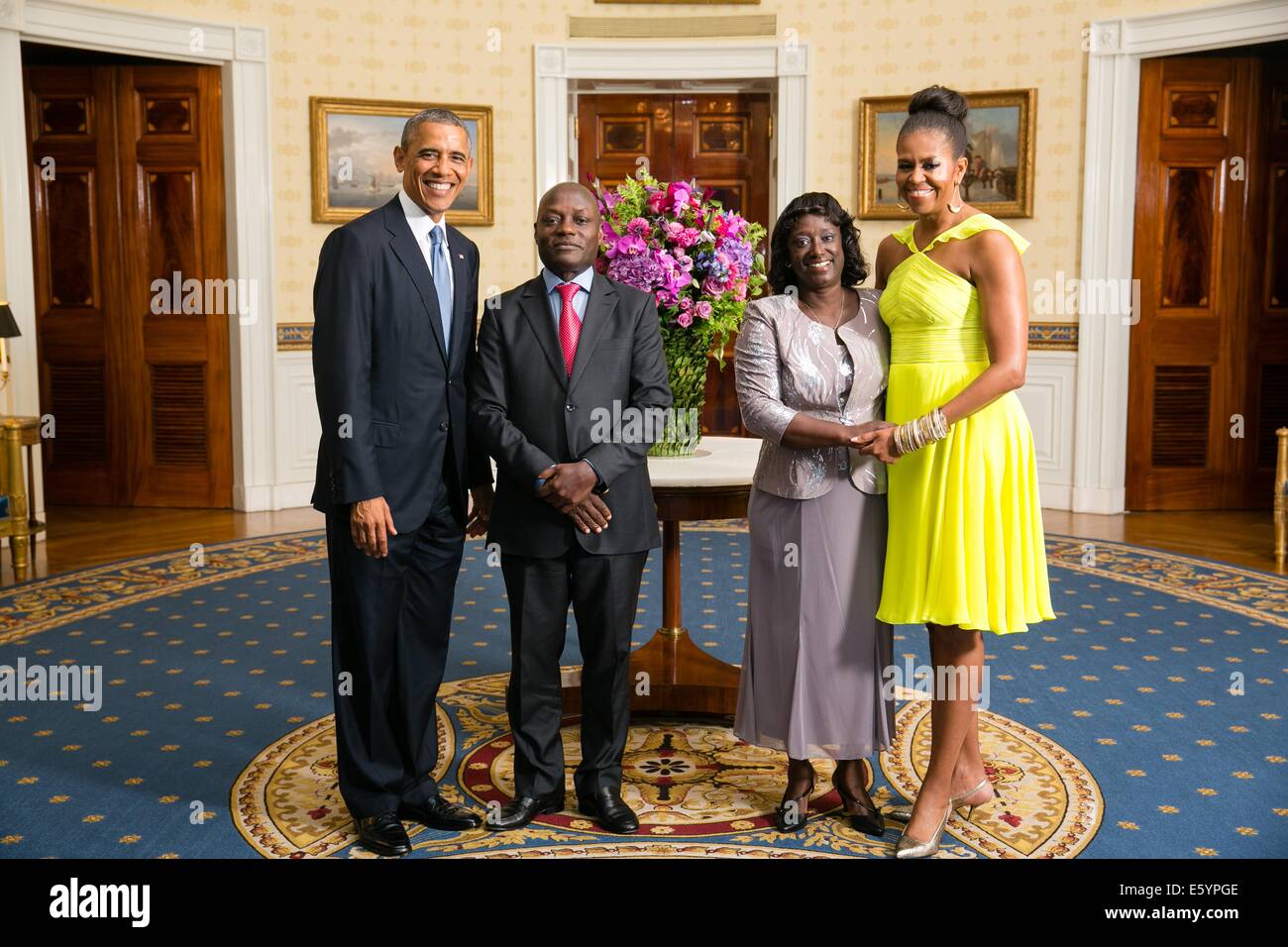 US President Barack Obama and First Lady Michelle Obama pose with JosŽ M‡rio Vaz, President of the Republic of Guinea-Bissau, and his wife Rosa Teixeira Goudiaby Vaz, in the Blue Room of the White House before the U.S.-Africa Leaders Summit dinner August 5, 2014 in Washington, DC. Stock Photo