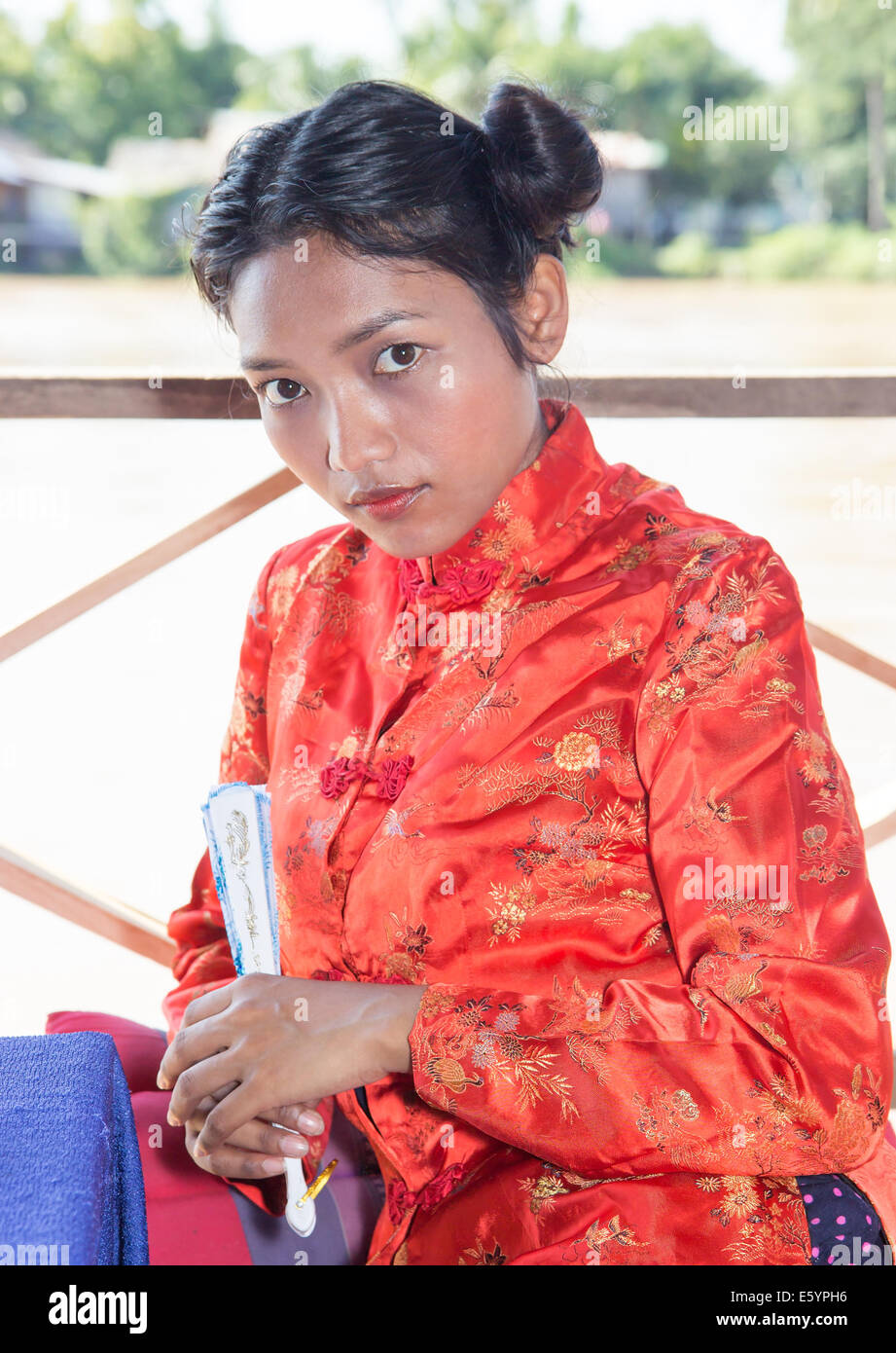 Asian woman holding fan Stock Photo