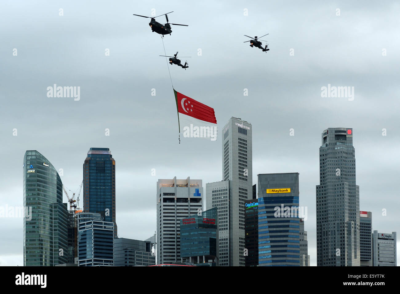 Singapore. 9th Aug, 2014. Helicopters of the Republic of Singapore Air Force (RSAF) fly with the National flag during the National Day Parade in Singapore on Aug. 9, 2014. Singapore celebrates the 49th anniversary of independence on Saturday. Credit:  Then Chih Wey/Xinhua/Alamy Live News Stock Photo