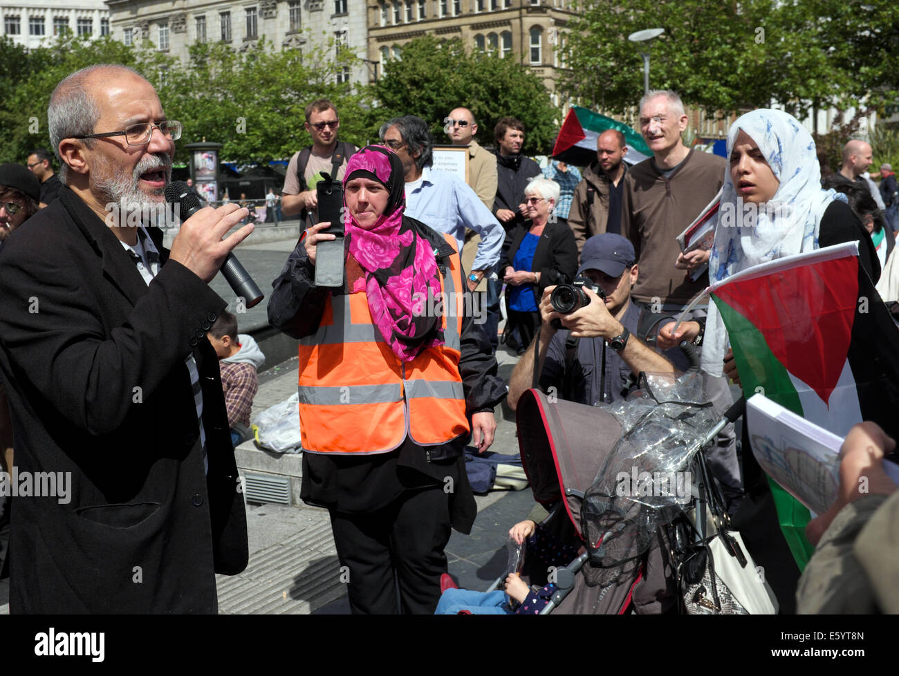 Manchester, UK. 9th August, 2014. A supporter of the Palestinian cause addresses a rally in Piccadilly Gardens. Palestinian Support Rally  Manchester, UK Credit:  John Fryer/Alamy Live News Stock Photo