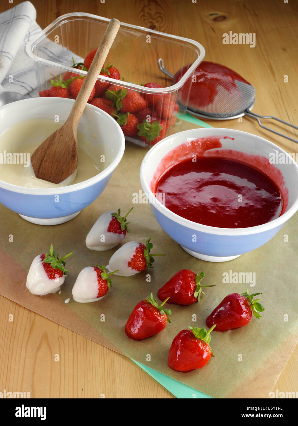 Dipping strawberries Stock Photo